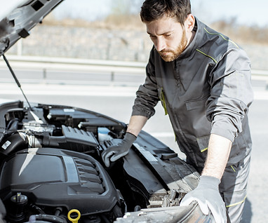 Mechanic repairing engine